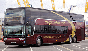 A megabus.com gold double-decker sleeper coach in the United Kingdom. They are longer than the US specification because of higher European axle weight limits.